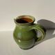Green glazed ceramic pitcher