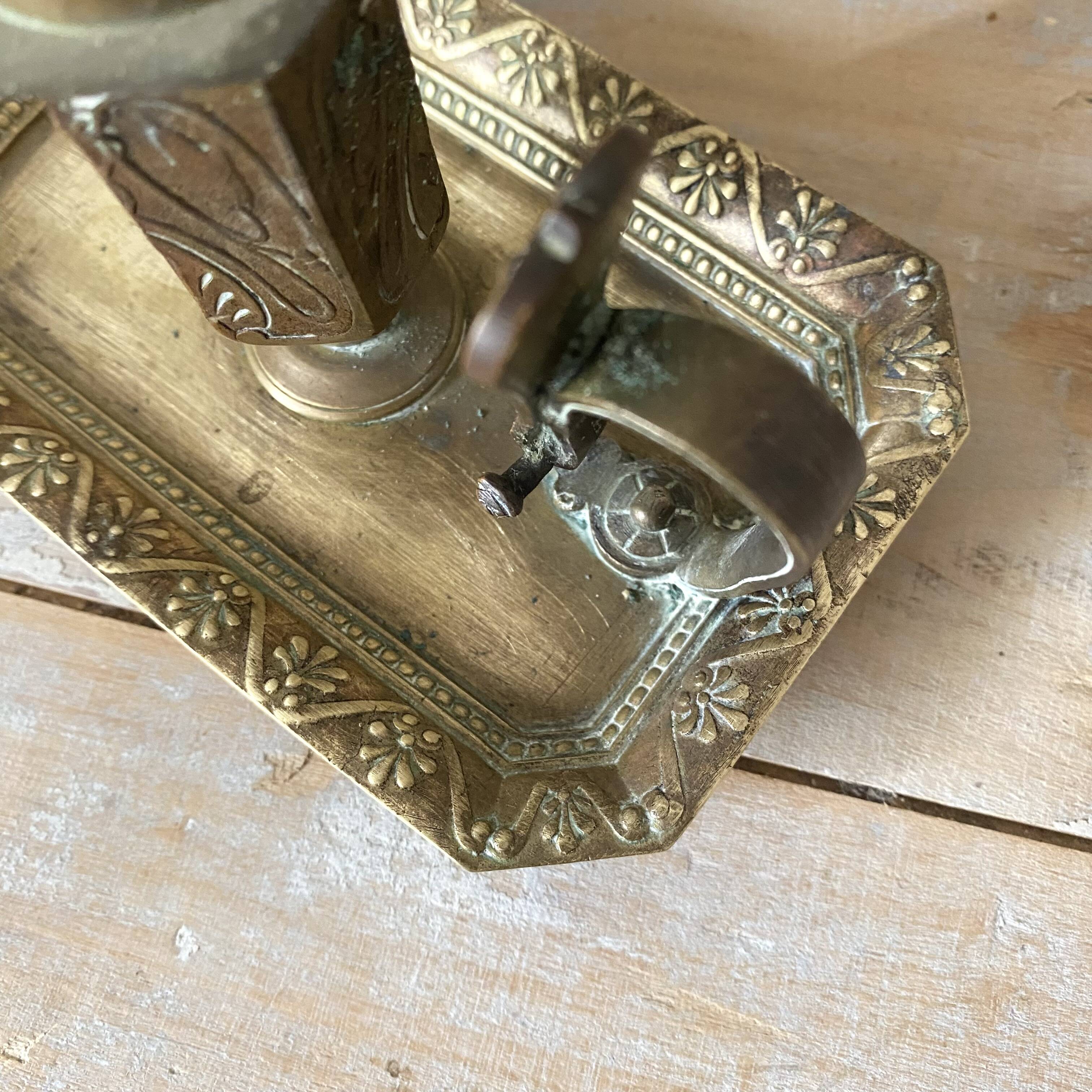 Antique brass thumb candle holder