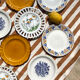 Set of twelve mismatched vintage dessert plates.