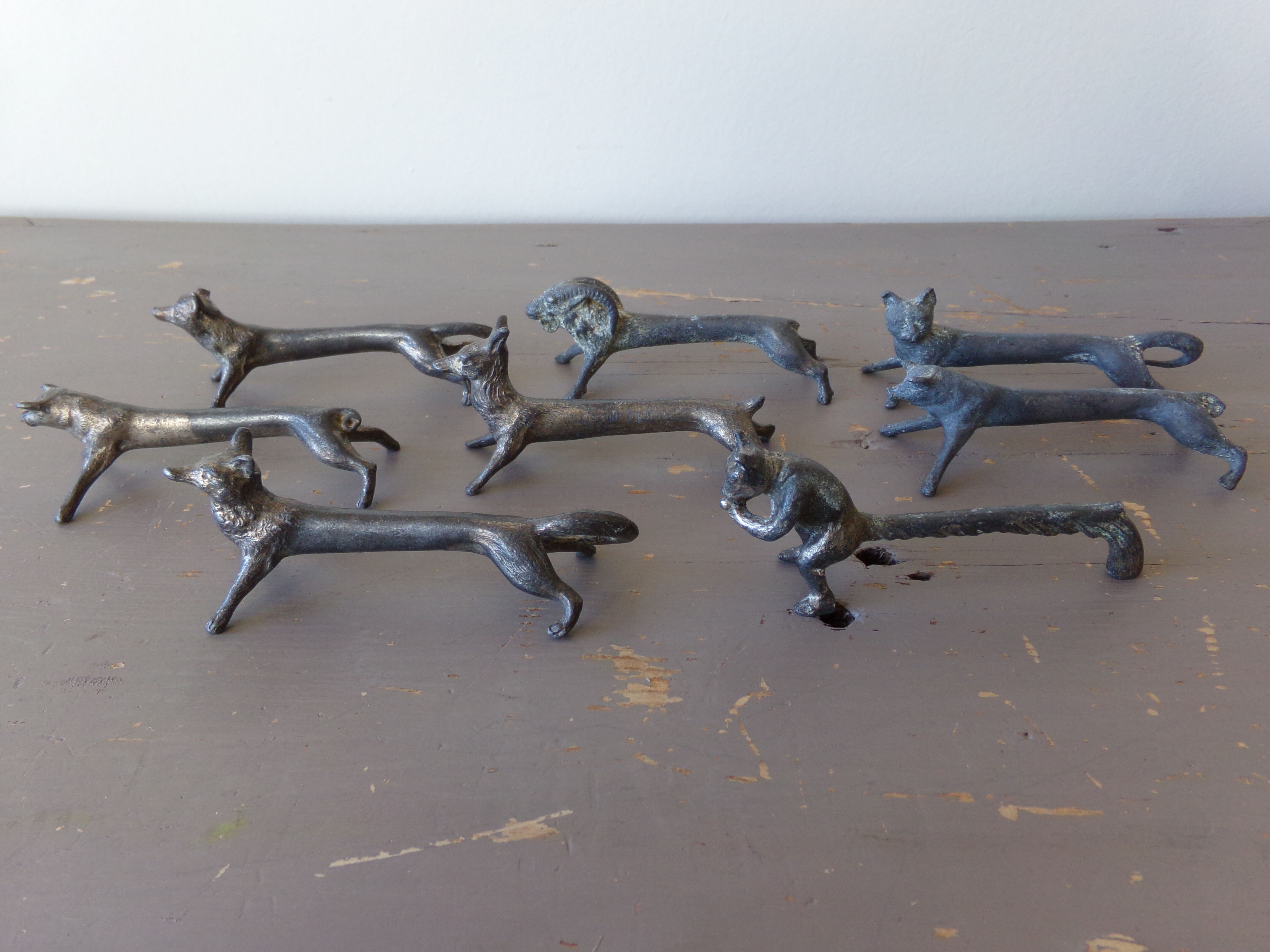 8 antique tin animal knife holders