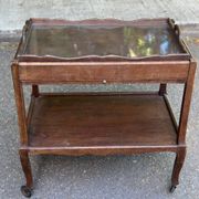Extendable wooden bar trolley with a glass top from the 1930s.