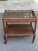 Extendable wooden bar trolley with a glass top from the 1930s.