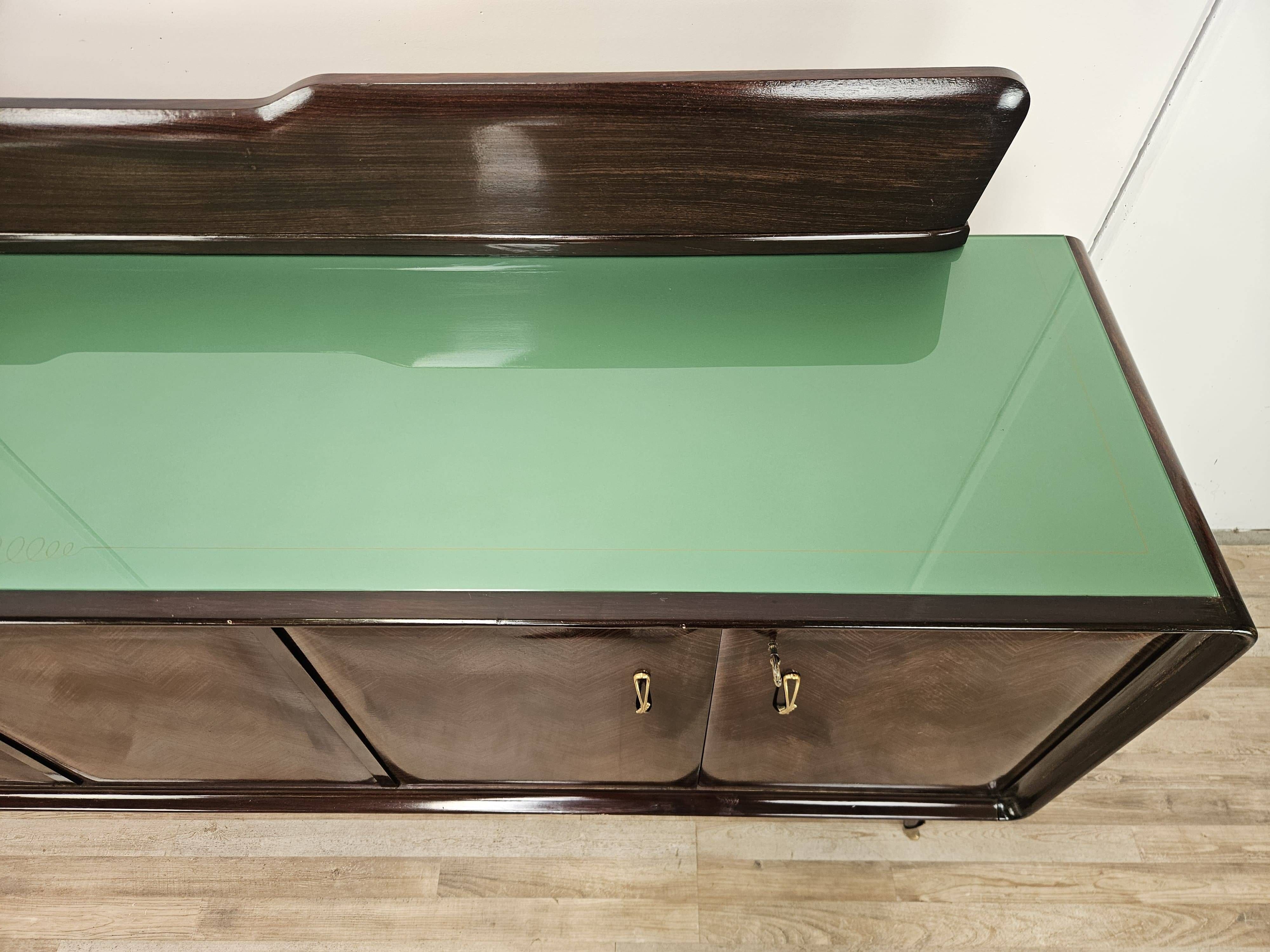 Mahogany sideboard with a glass top, 1960