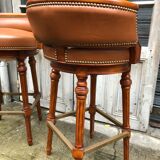 Pair of bar stools turning bar rests brass feet Hollywood Regency