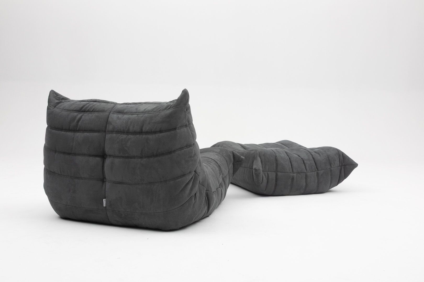 Togo lounge chair and pouf in black fabric by Michel Ducaroy for Ligne Roset, 1973, set of 2
