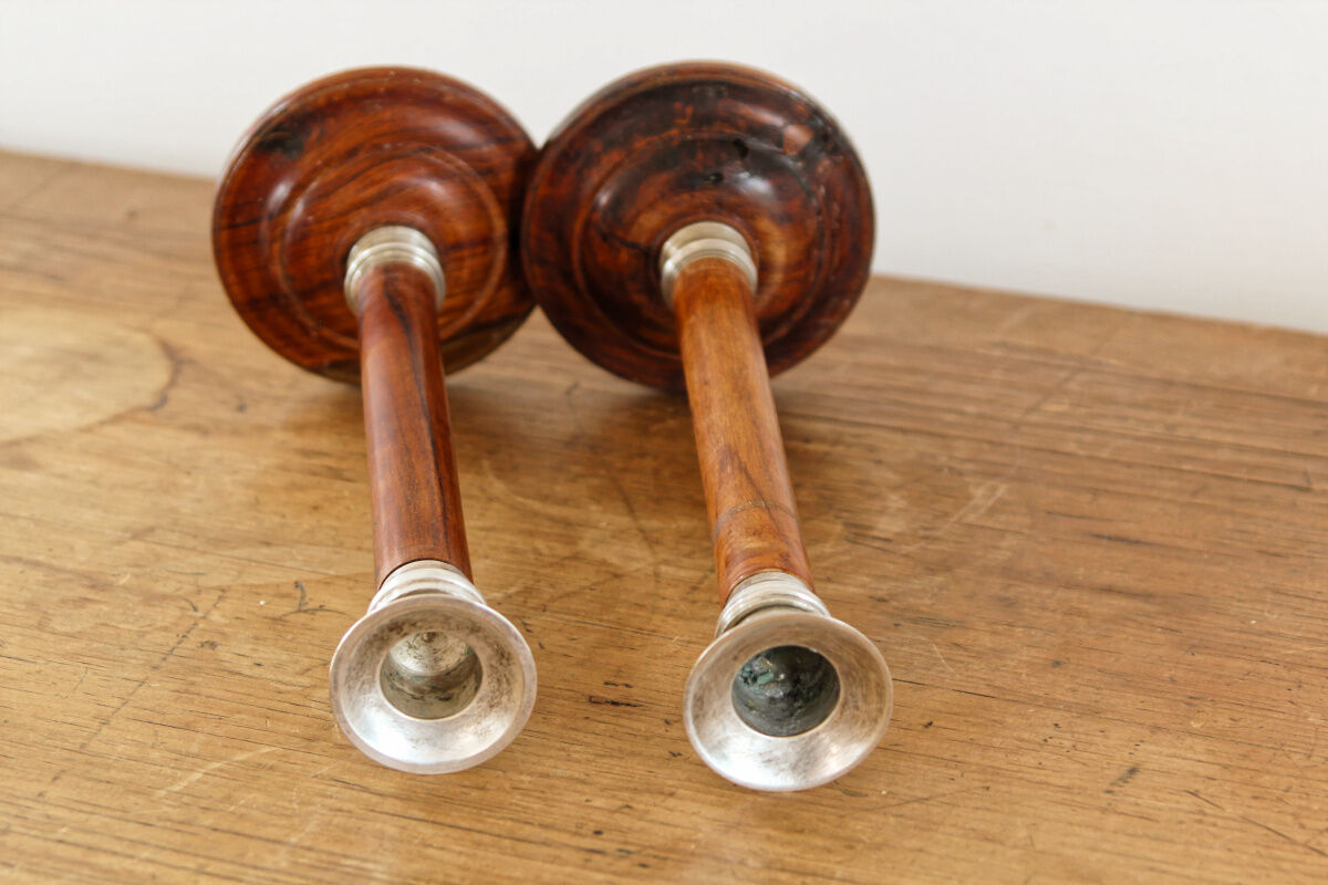 Pair of Indian candle holders, wood and silver metal