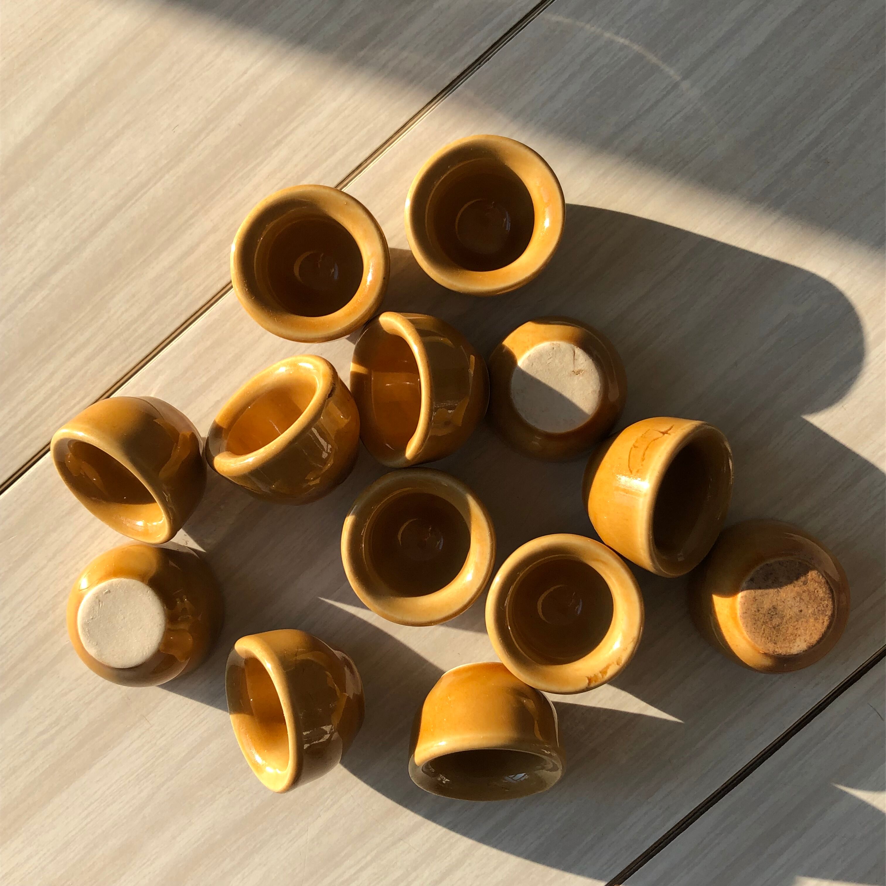13 snail buckets or eggcups in fire porcelain glazed yellow-brown color