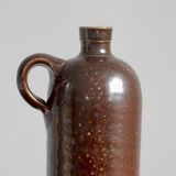 Enamelled brown sandstone bottle with handle