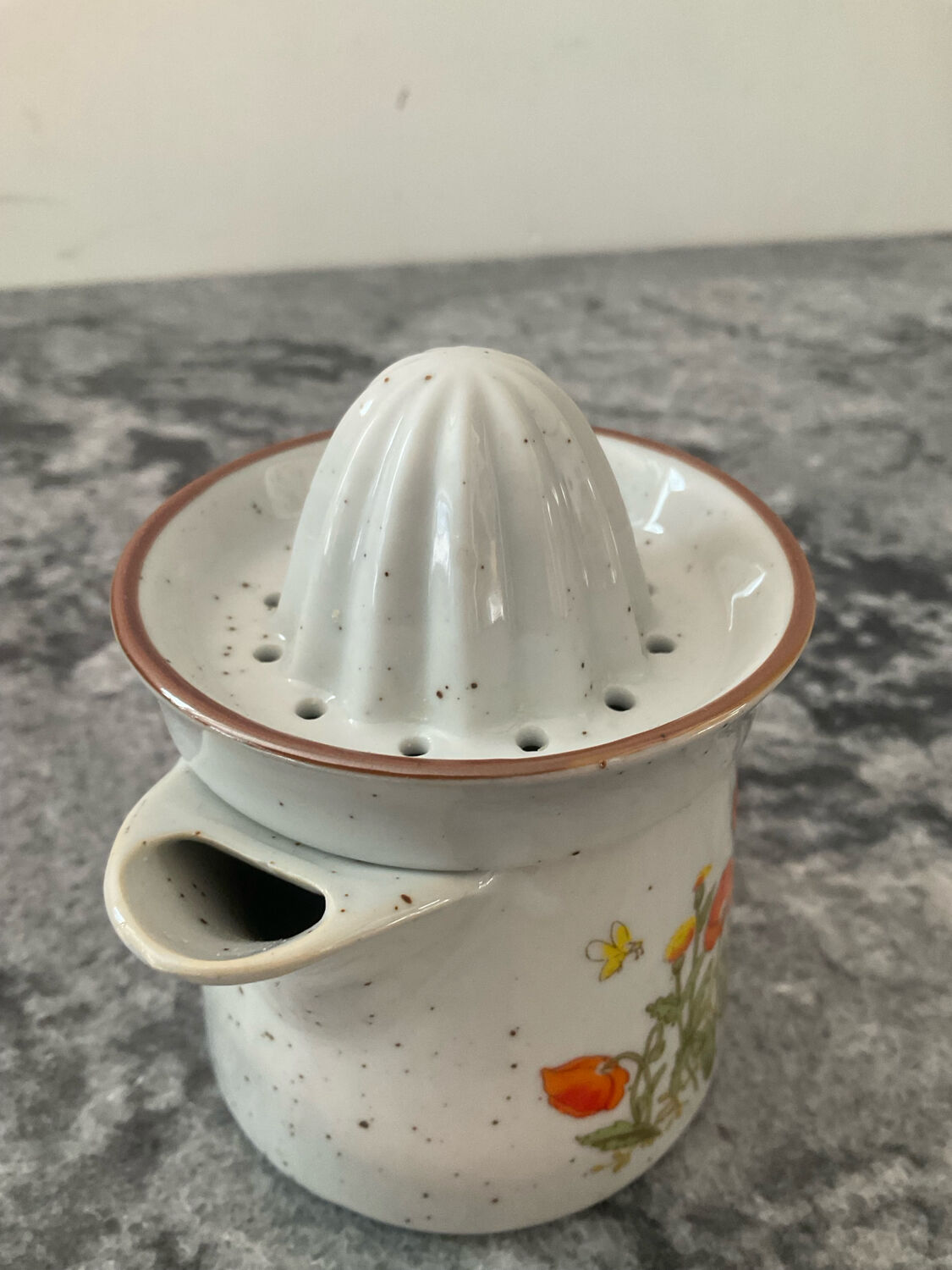 Vintage stoneware jug and its citrus juicer.