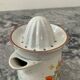 Vintage stoneware jug and its citrus juicer.