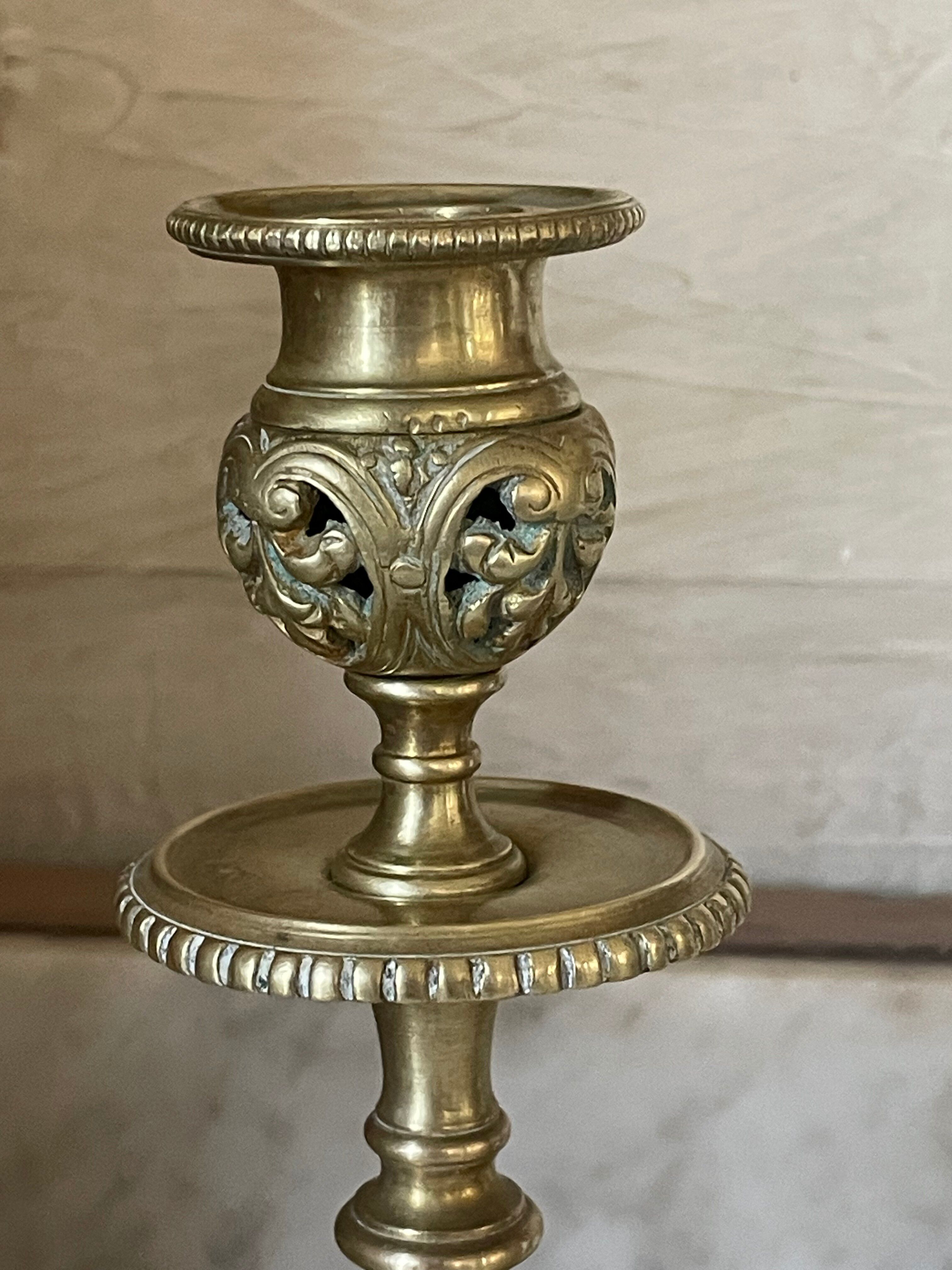 pair of openwork gilded brass candlesticks from the 19th century