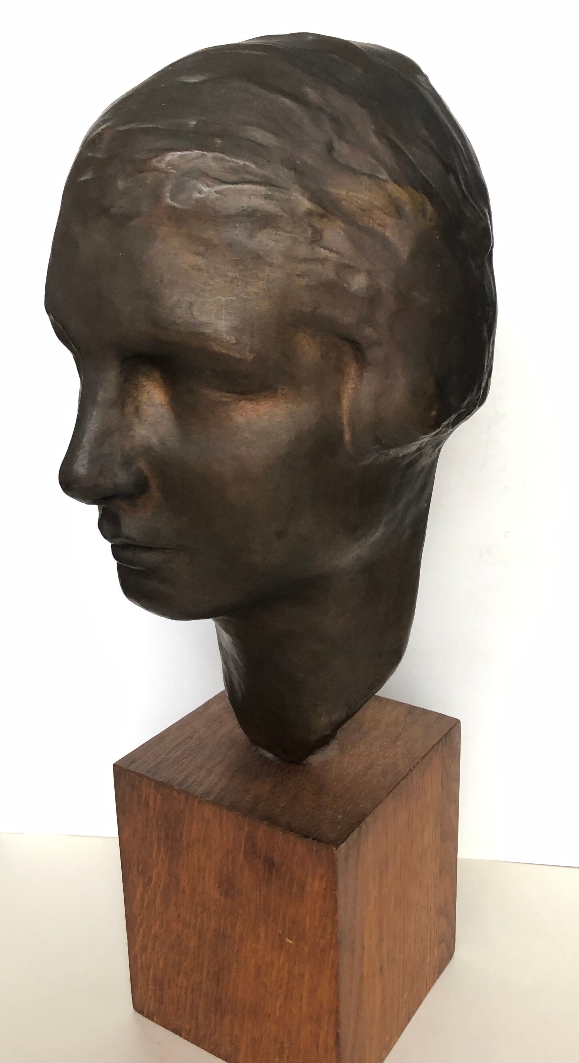 Bronze young woman's head