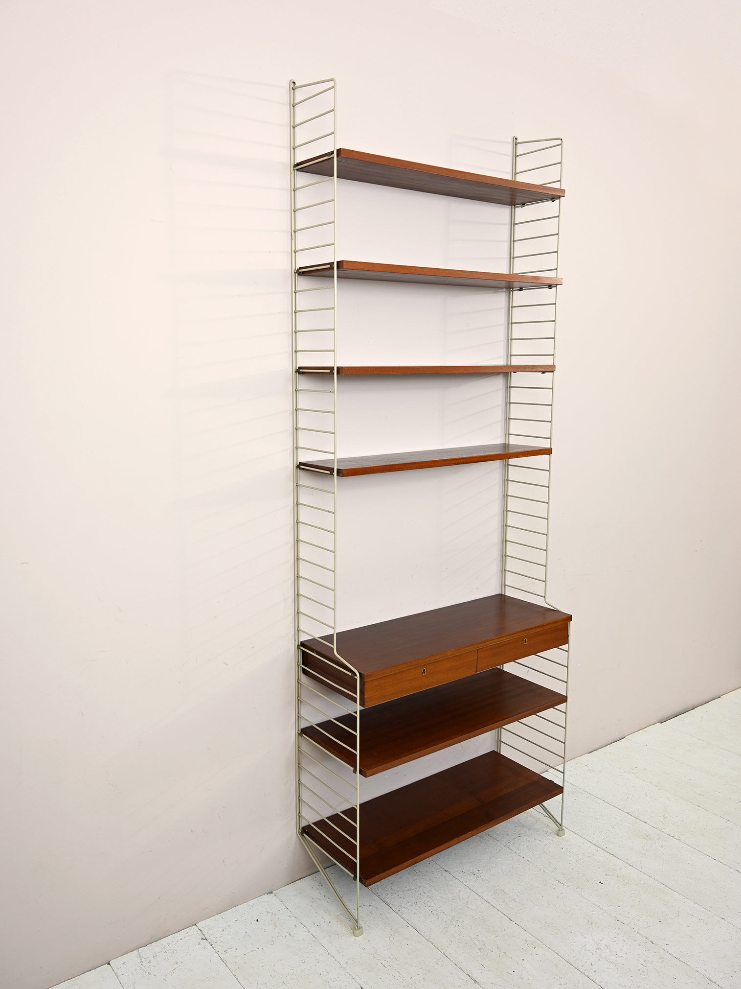 'string' bookcase with metal frame
