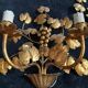 Stunning vintage wall lights in gilded iron with vine and grape decor from Italy.