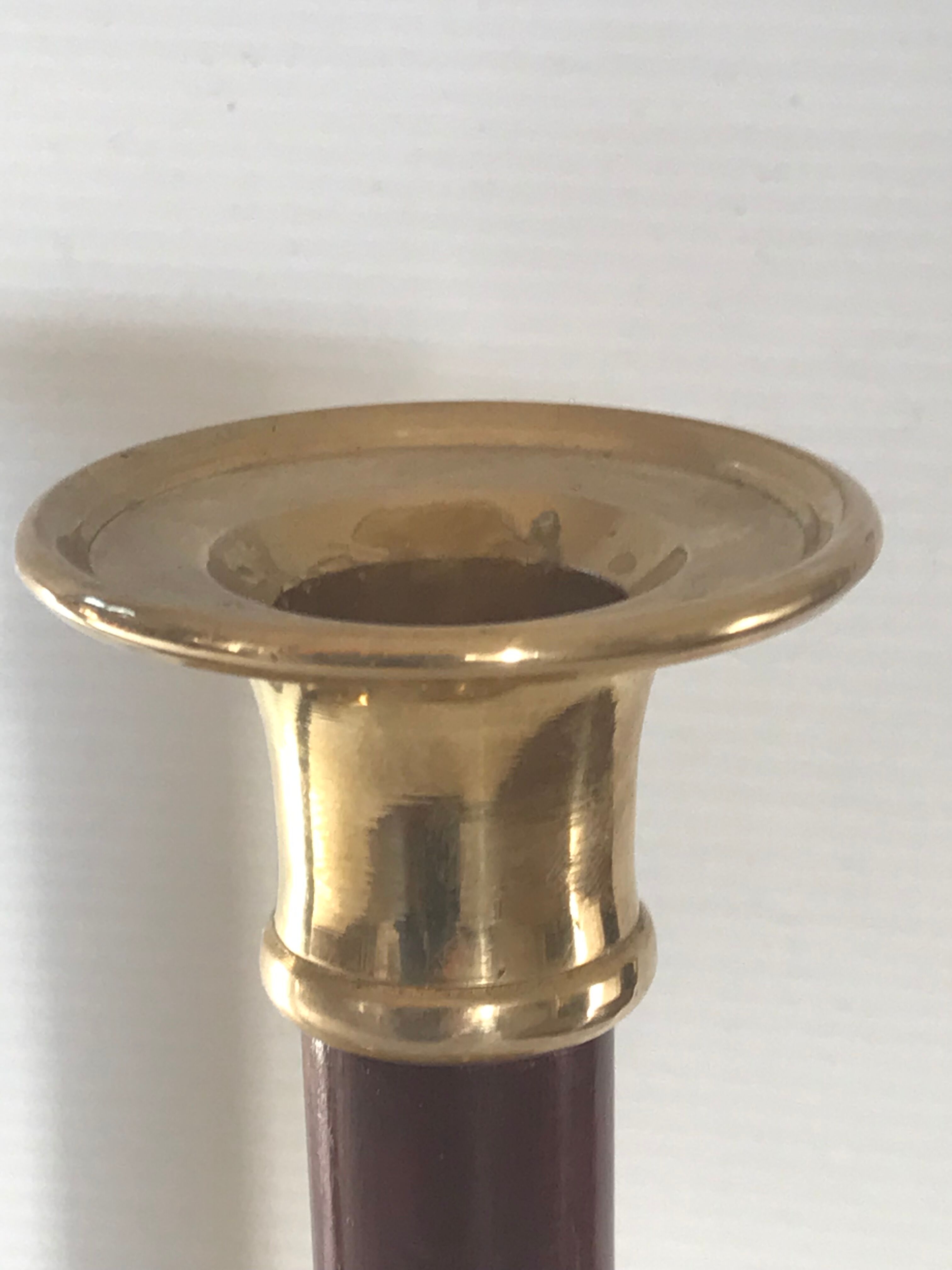 Pair of Scandinavian brass and teak candle holders