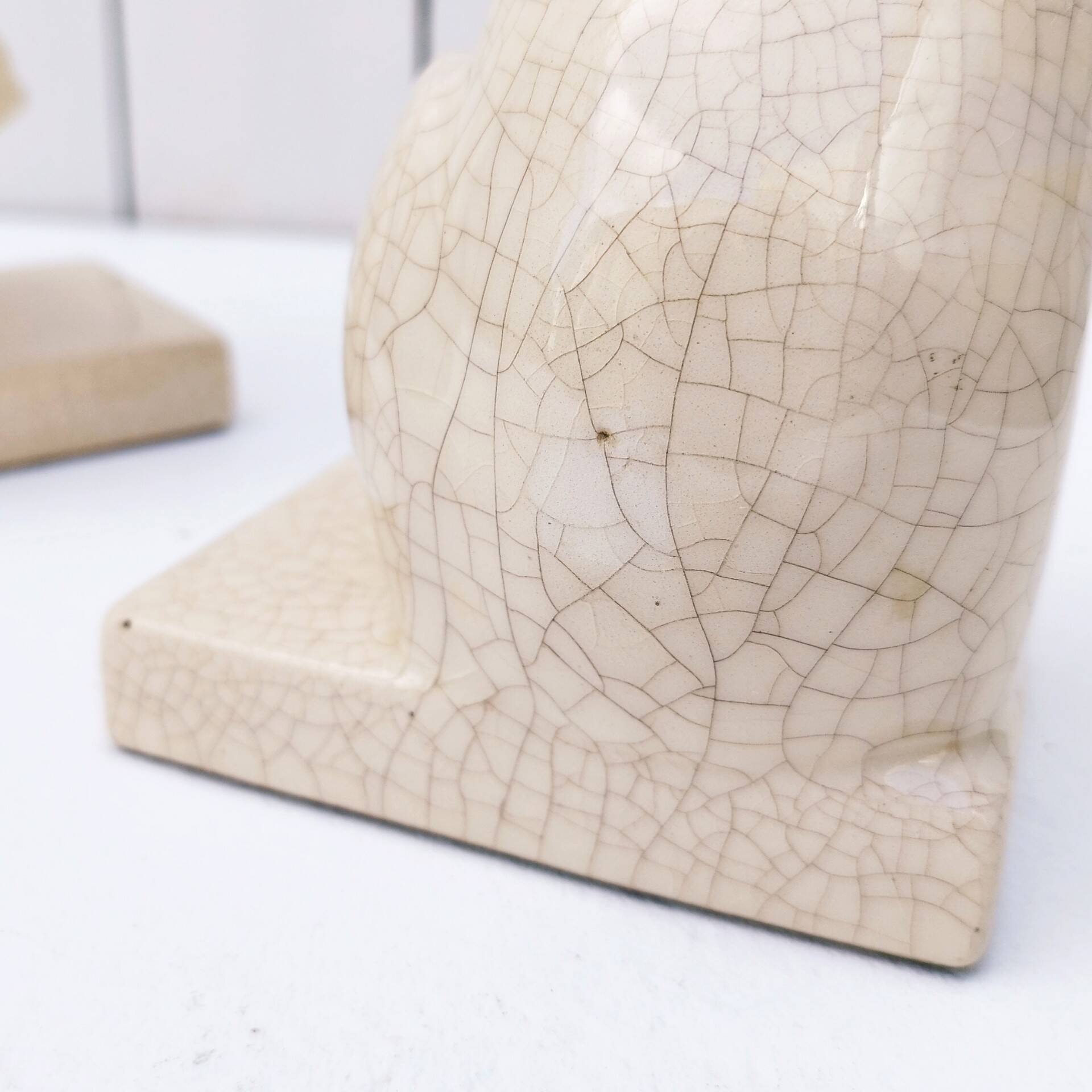 Cracked ceramic bookends with a couple of bears