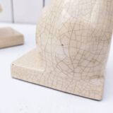 Cracked ceramic bookends with a couple of bears