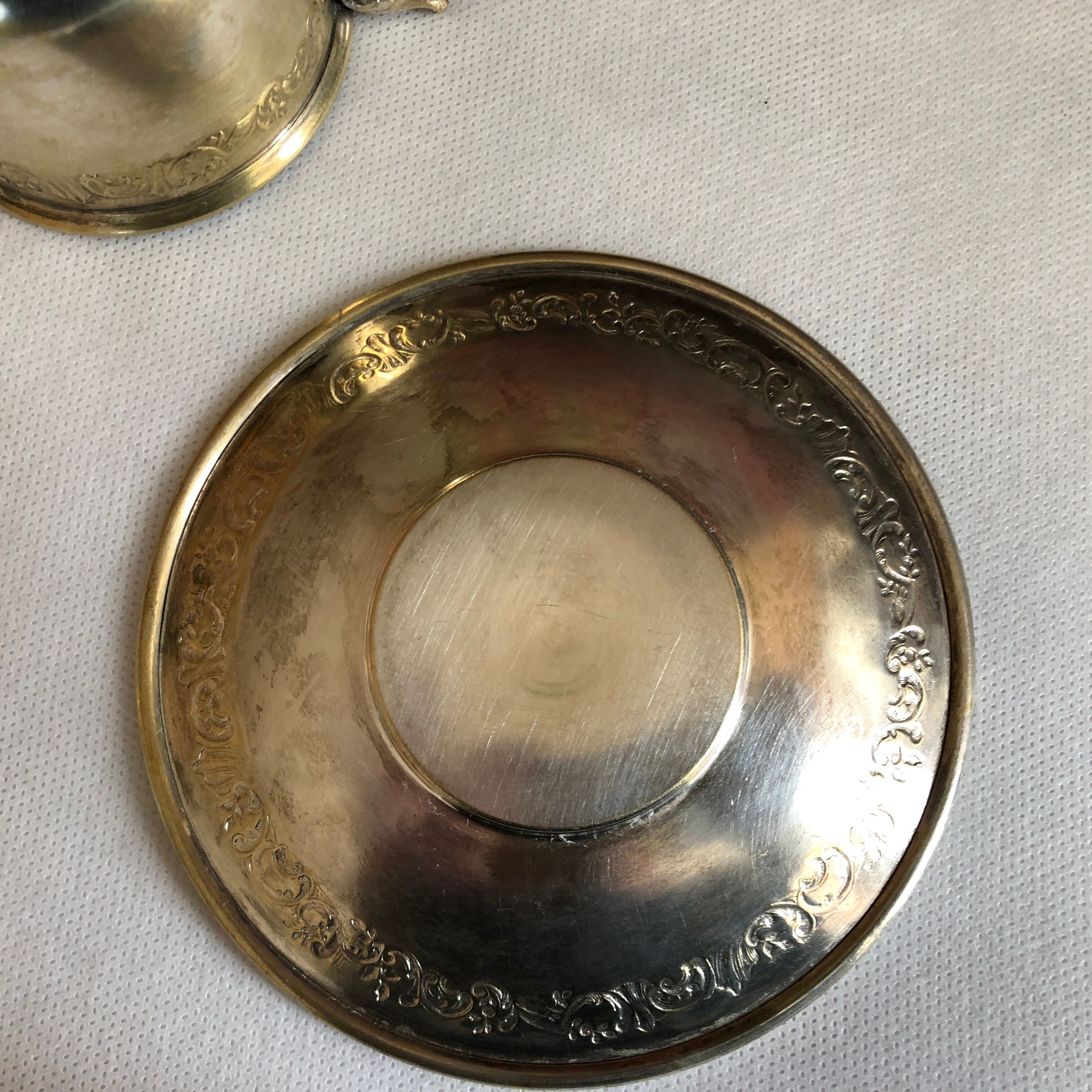 Silver metal cup and saucer