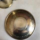 Silver metal cup and saucer