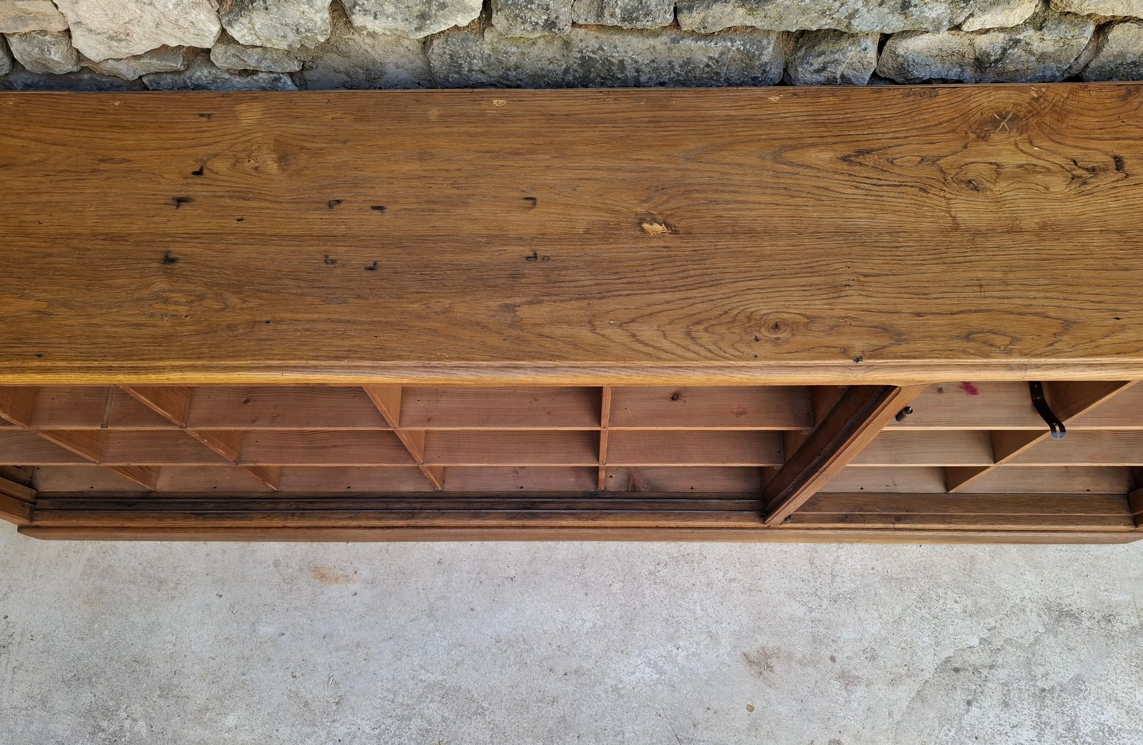 Oak workshop furniture with sliding doors.