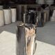 Black petrified wood side table with beige stripes, star pattern H35 D24.