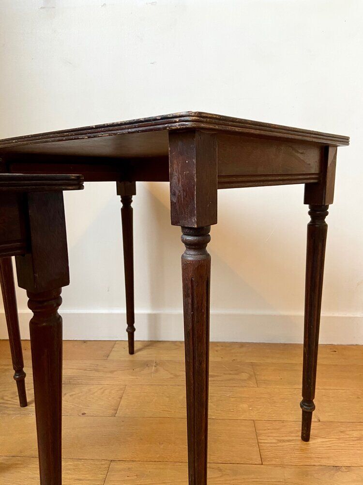 Dark wood and black leather tables