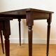 Dark wood and black leather tables