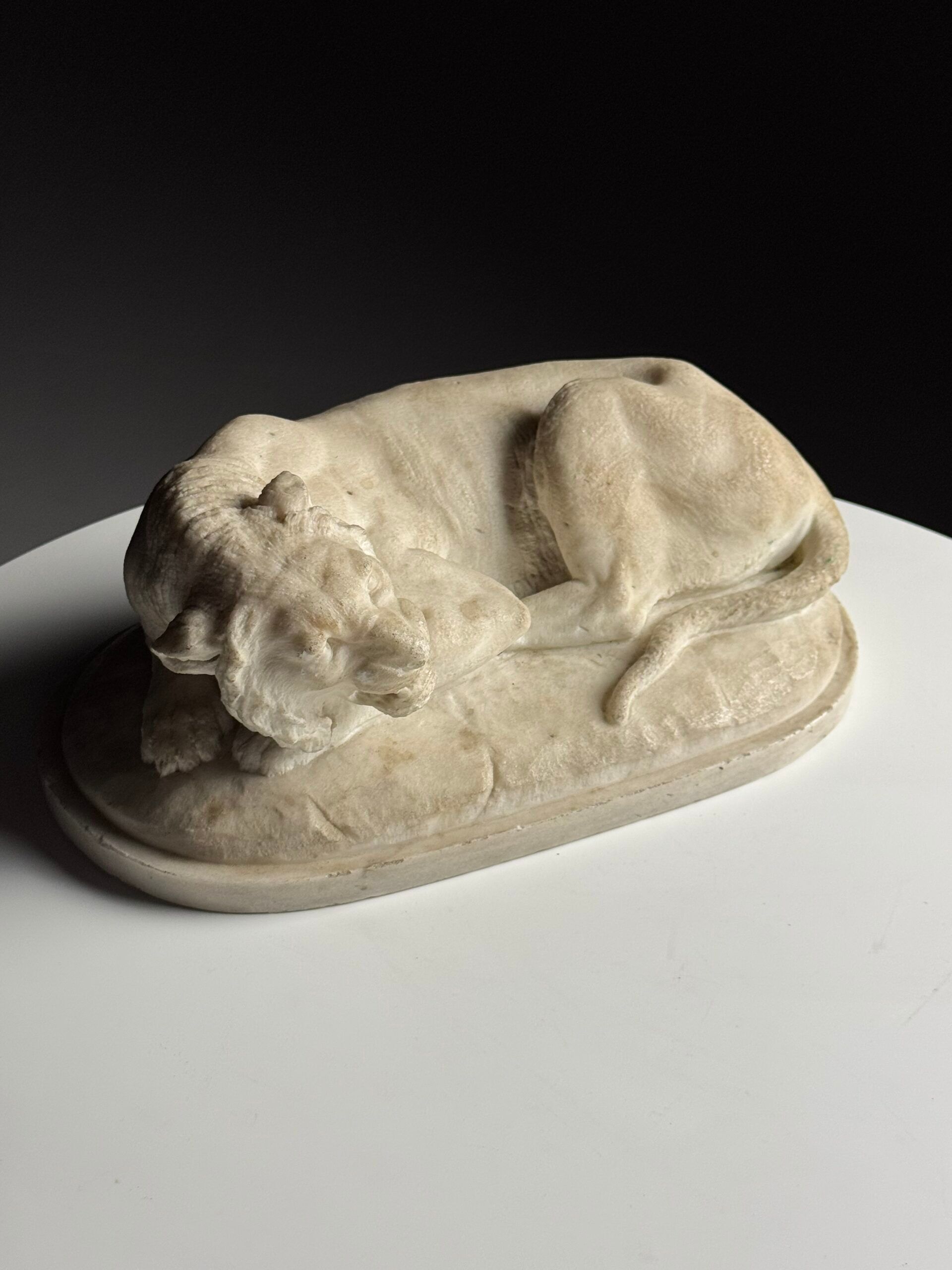 Marble sculpture of a reclining lion