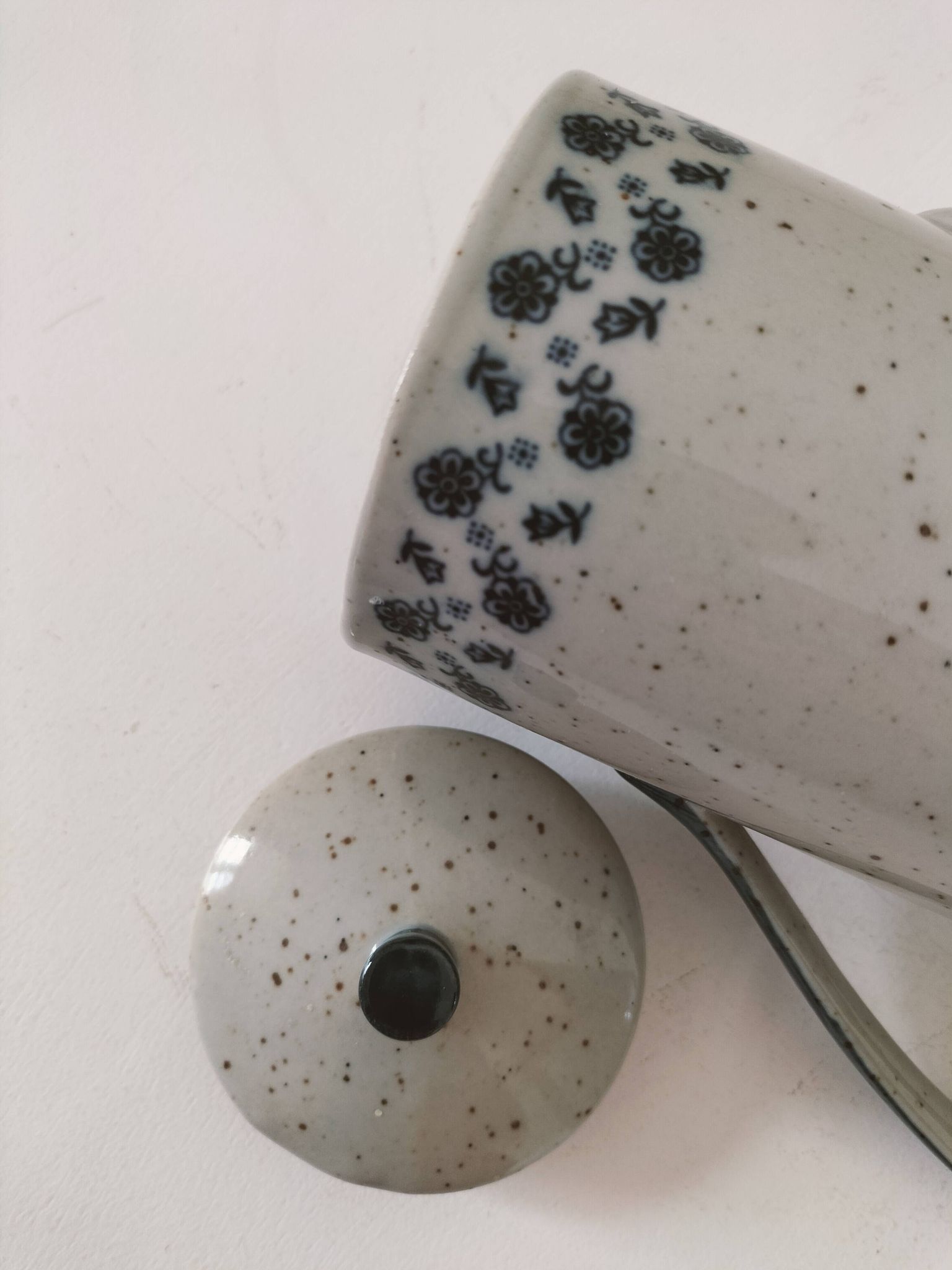 Vintage speckled stoneware coffee pot – navy blue floral decoration