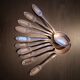 10 small silver metal spoons