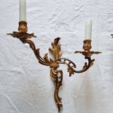 Pair of vintage French wall sconces in bronze, Louis XV Rococo style.