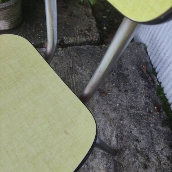 Pair of yellow formica chairs