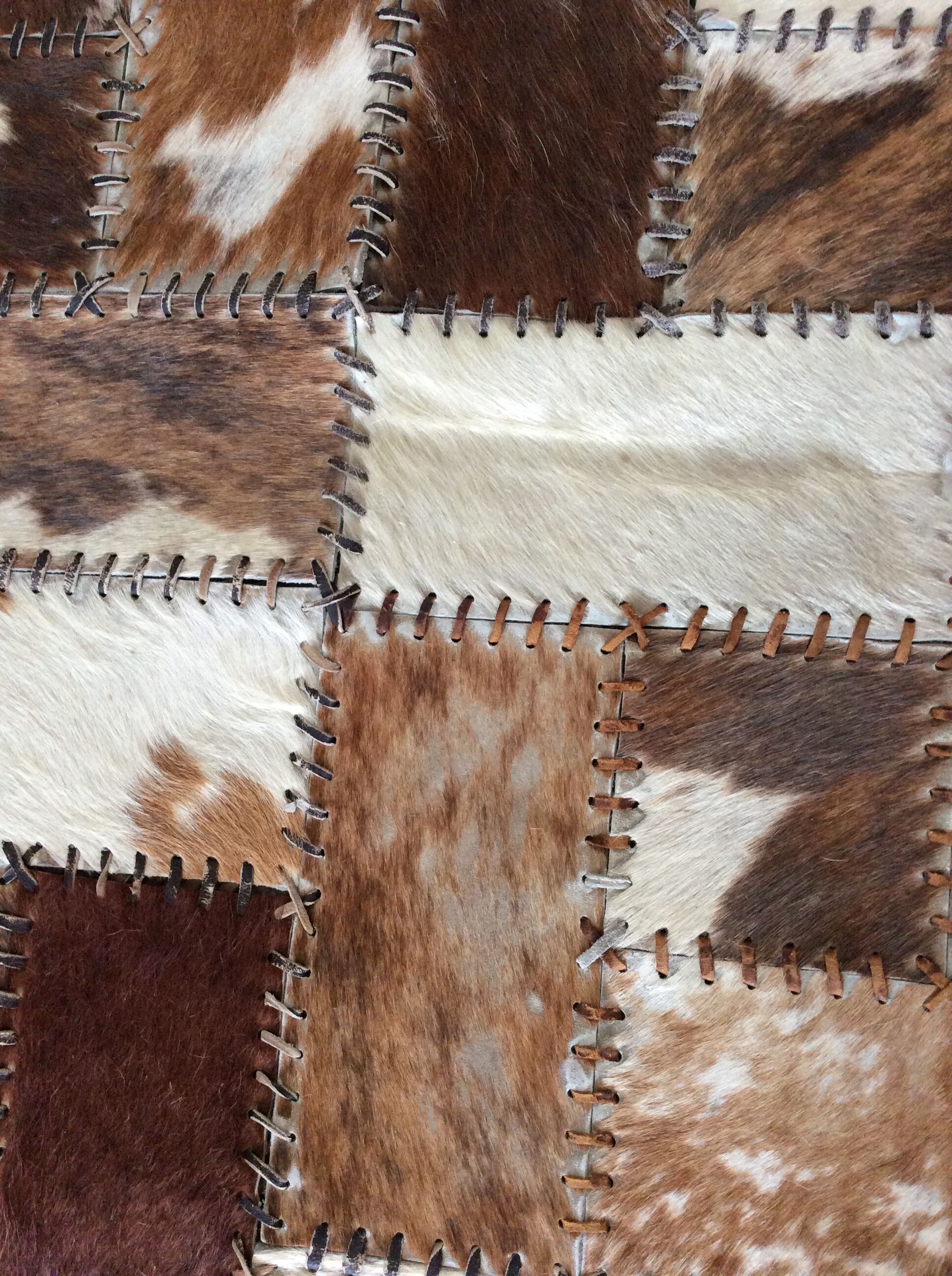 Patchwork carpet in cowhide 164x105cm from the 70s