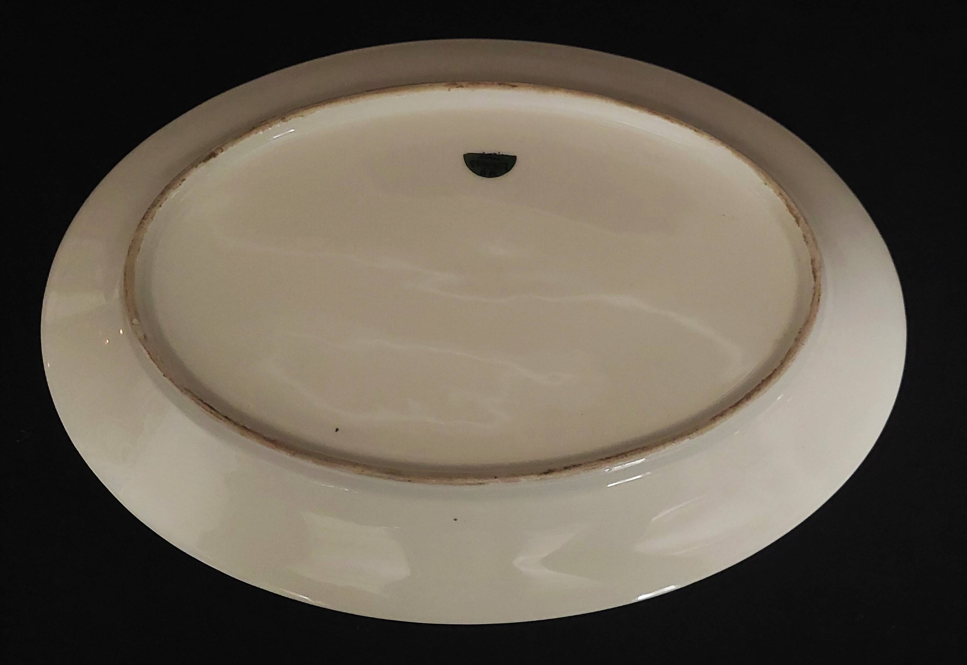 Oval porcelain serving dish decorated with roses MF Limoges