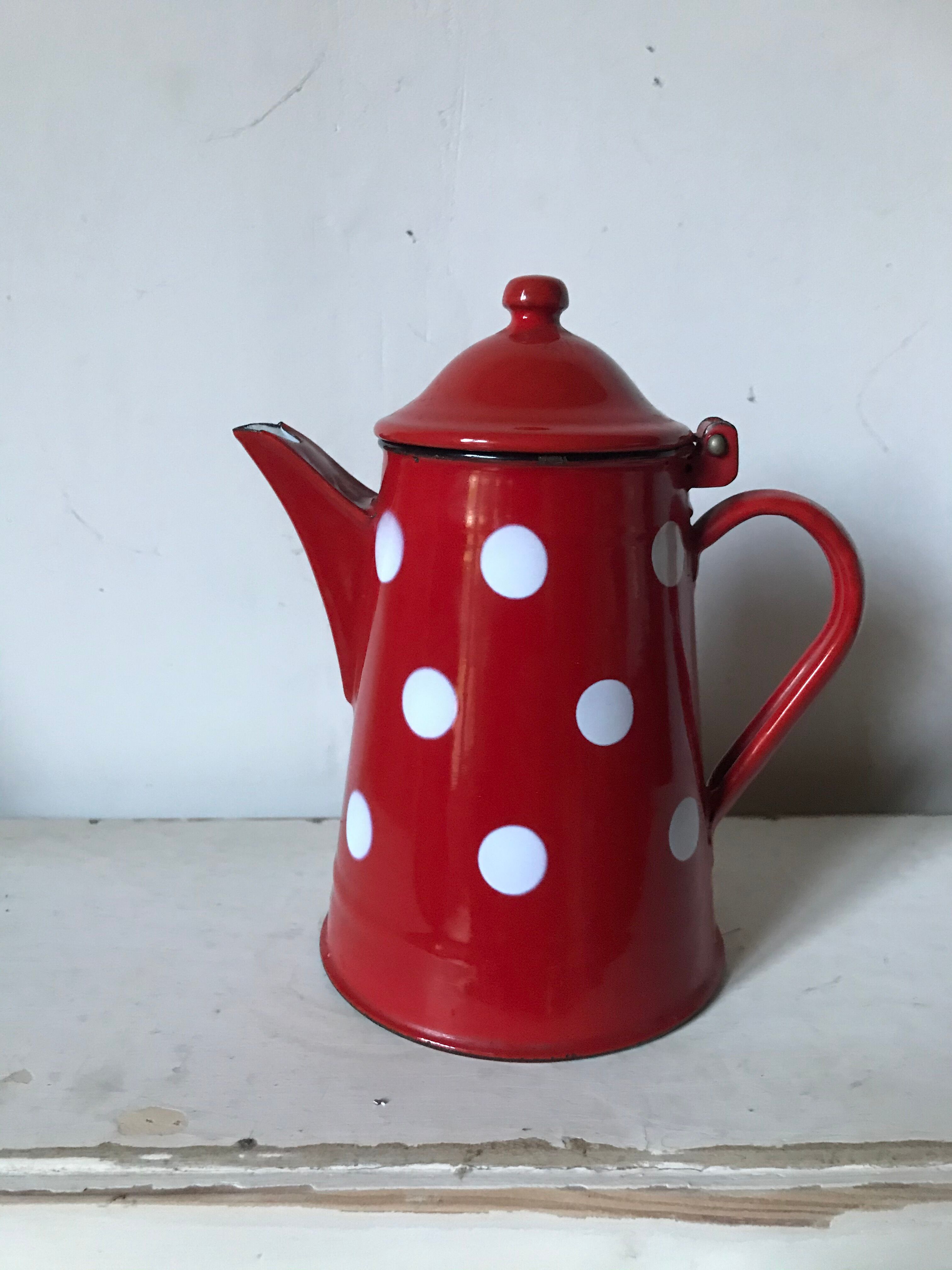 Red enamelled coffee maker with white polka dots