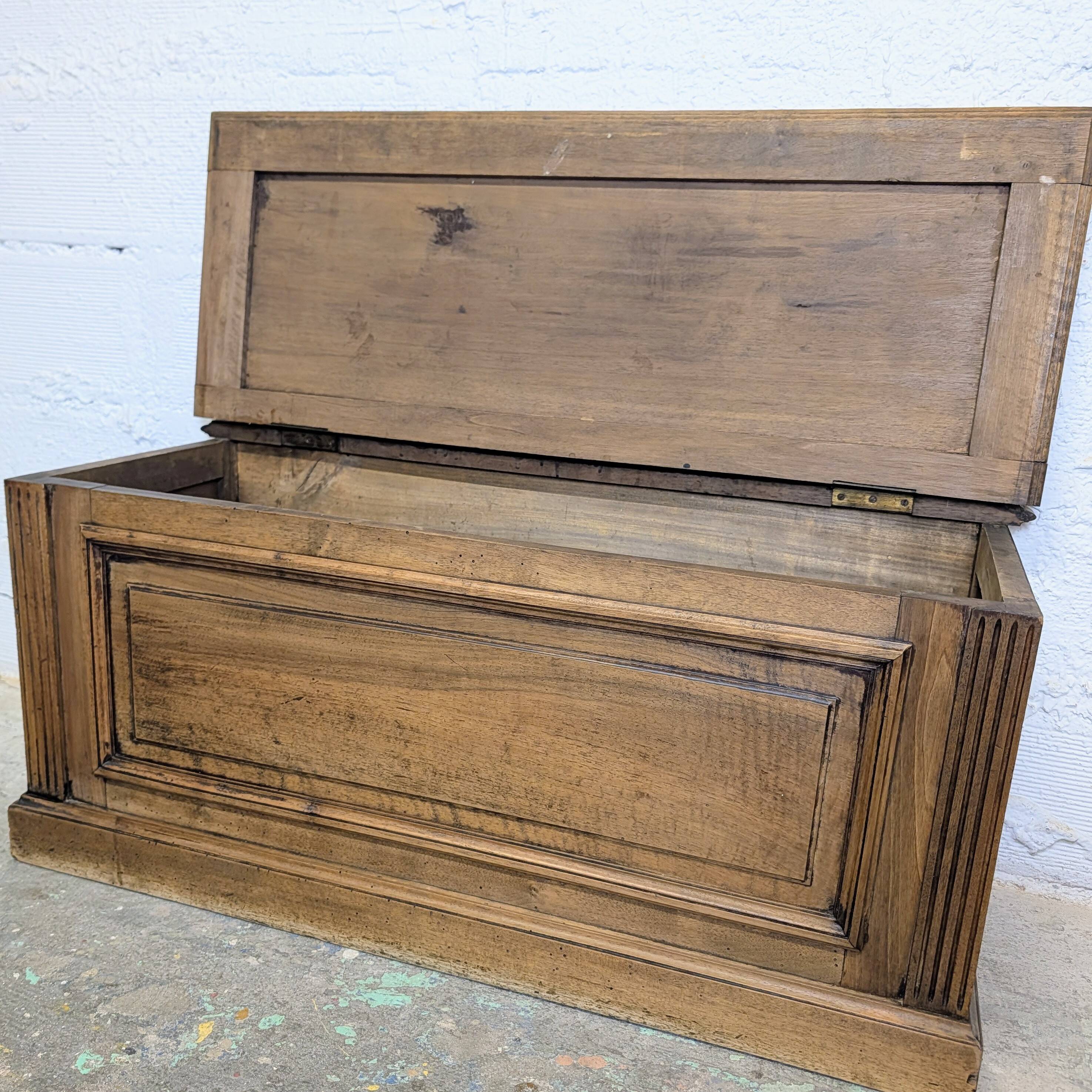 Antique wooden chest with moulded panels
