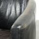 Black vintage cowhide aviator design armchair with characterful appearance