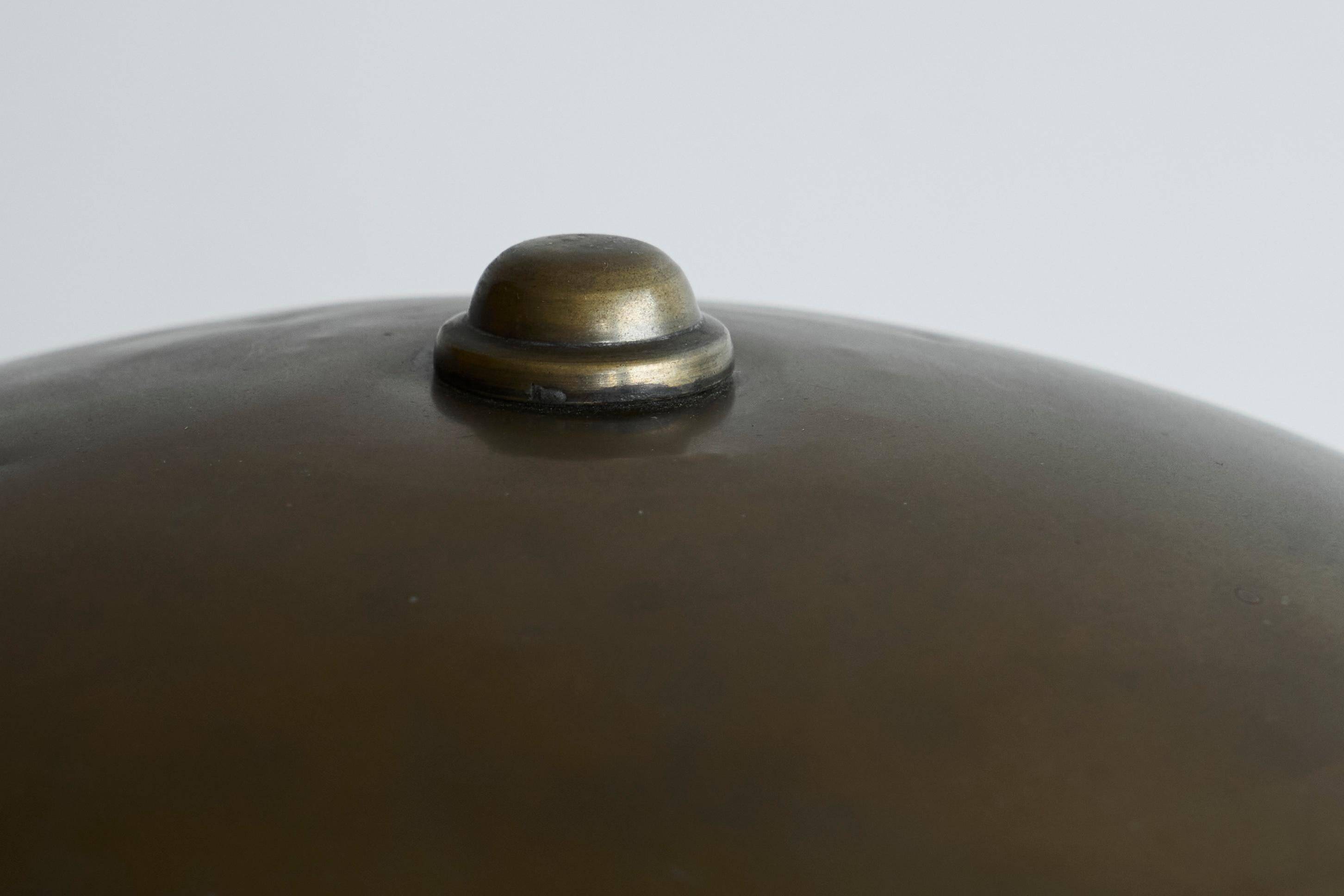 Bauhaus style table lamp in patinated brass from the 1930s.