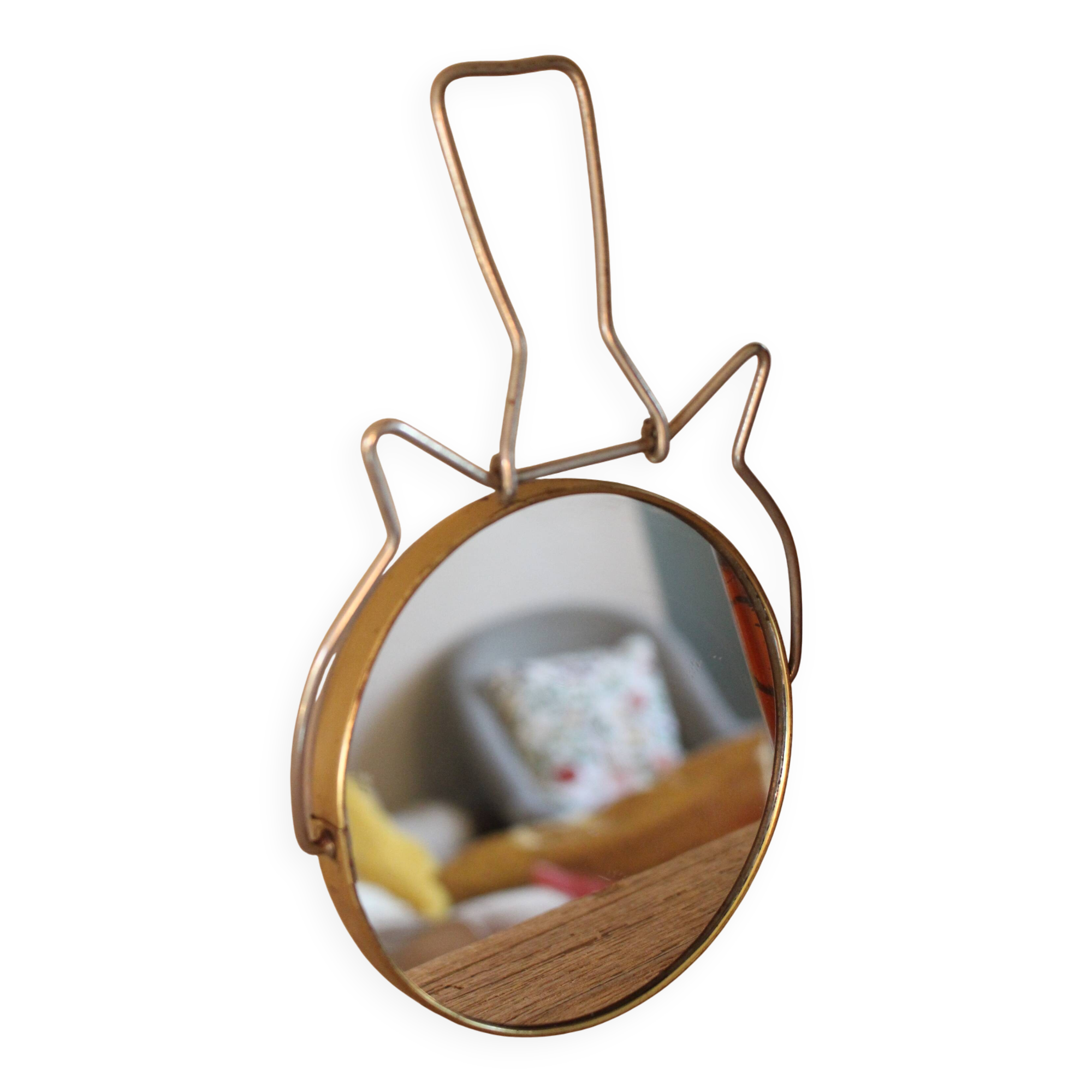 Antique round barber mirror in gilded metal