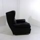 Fauteuil à oreilles en cuir noir sur roulettes années 1960