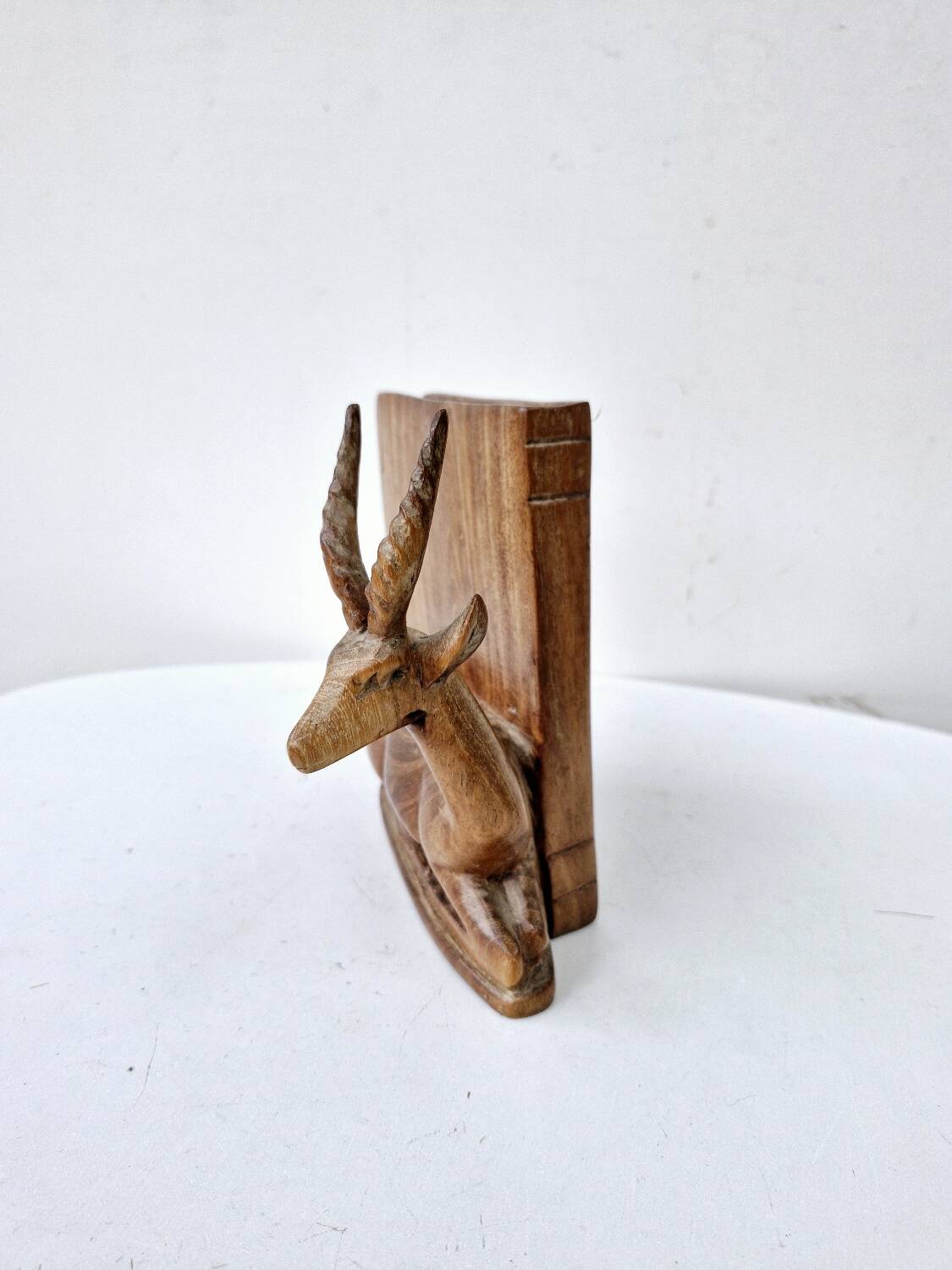 Old antelope bookend in hand carved wood