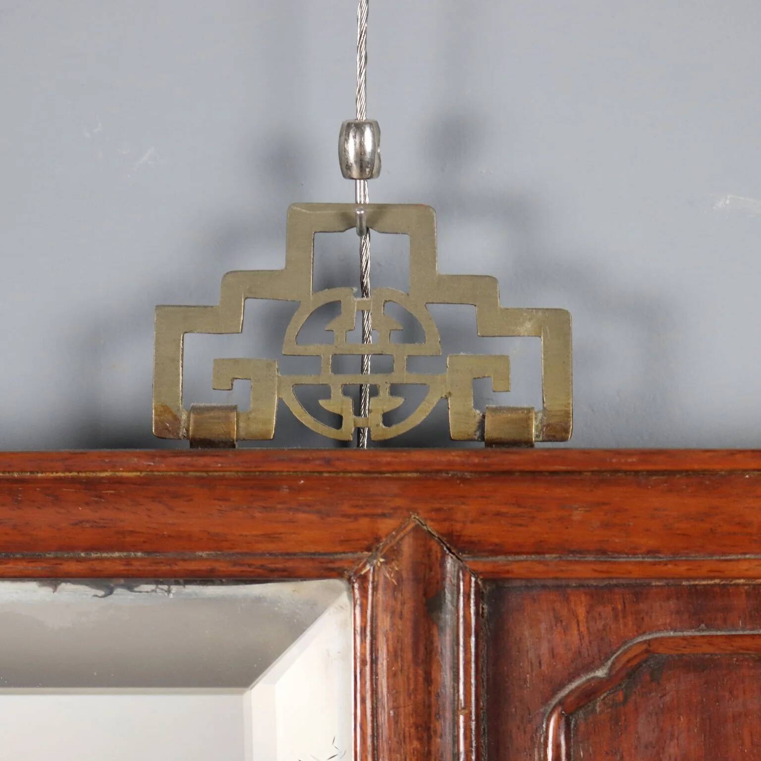 Antique mirror in exotic wood with chinoiserie carvings, 19th century.