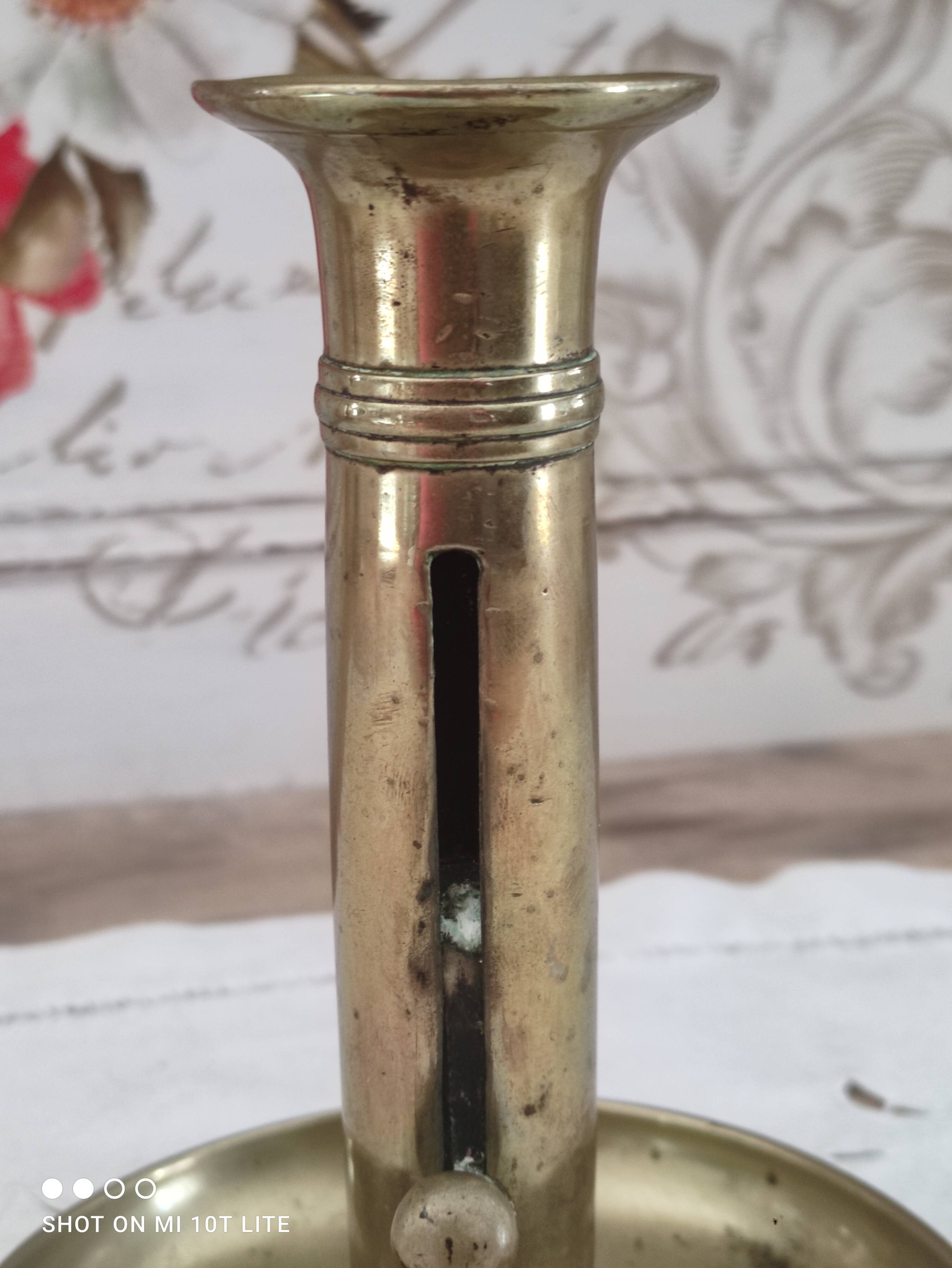 Brass push candle holder on frame