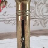 Brass push candle holder on frame