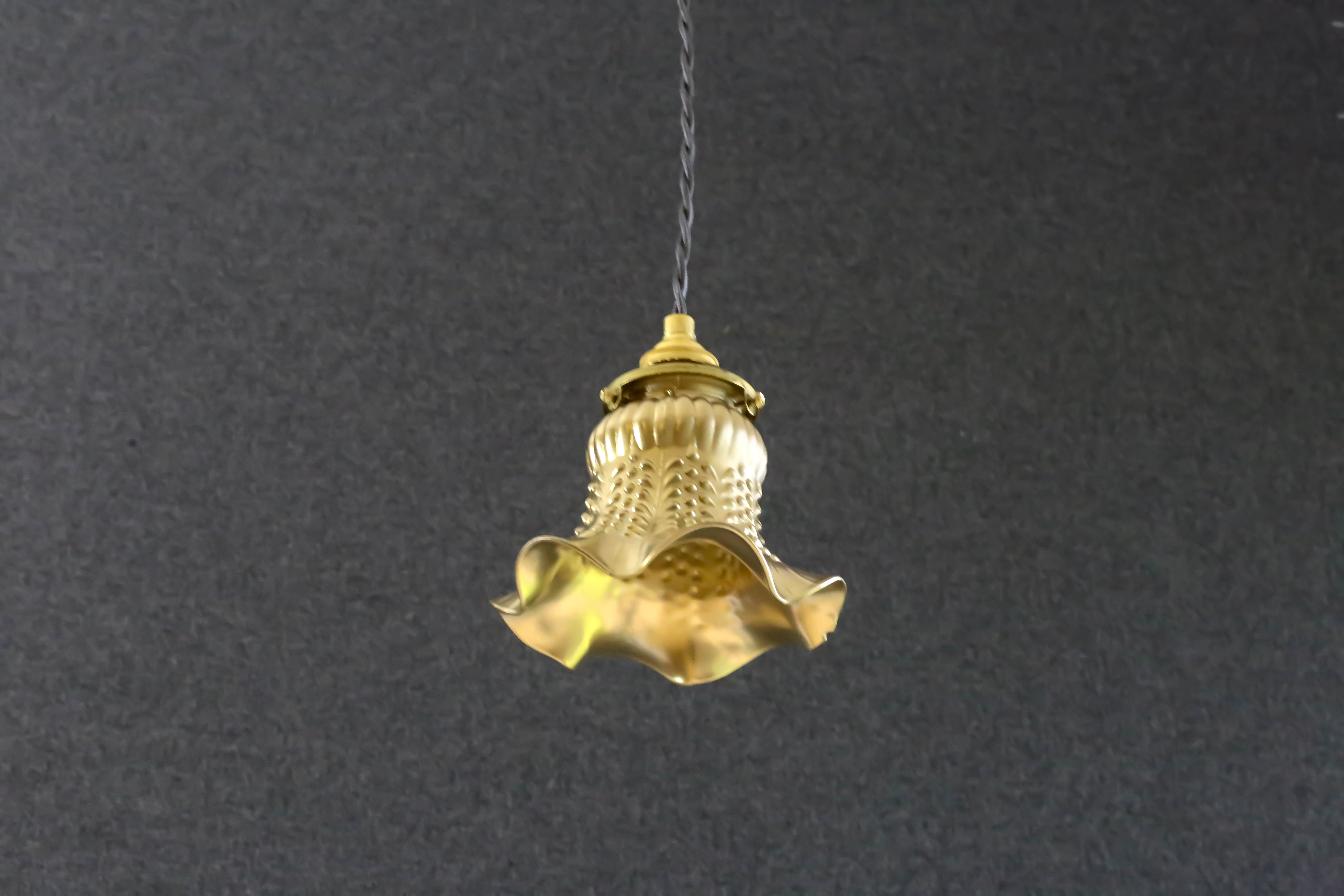 Old tulip suspension painted gold with new brass