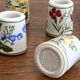 Set of 9 mini vintage porcelain candle holders decorated with spring flowers.