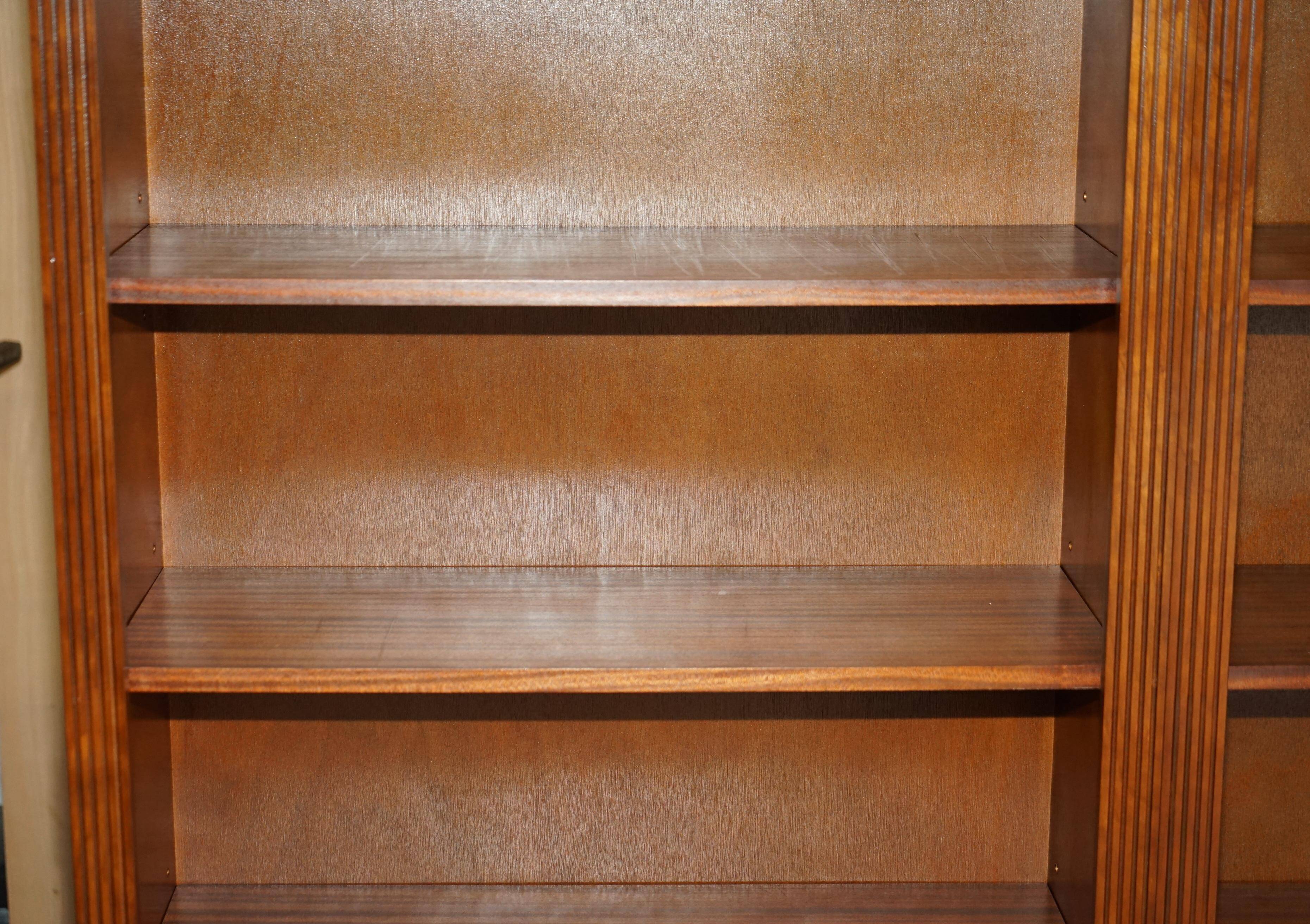 Corner library made of flamed hardwood, in 3 parts.