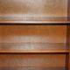 Corner library made of flamed hardwood, in 3 parts.