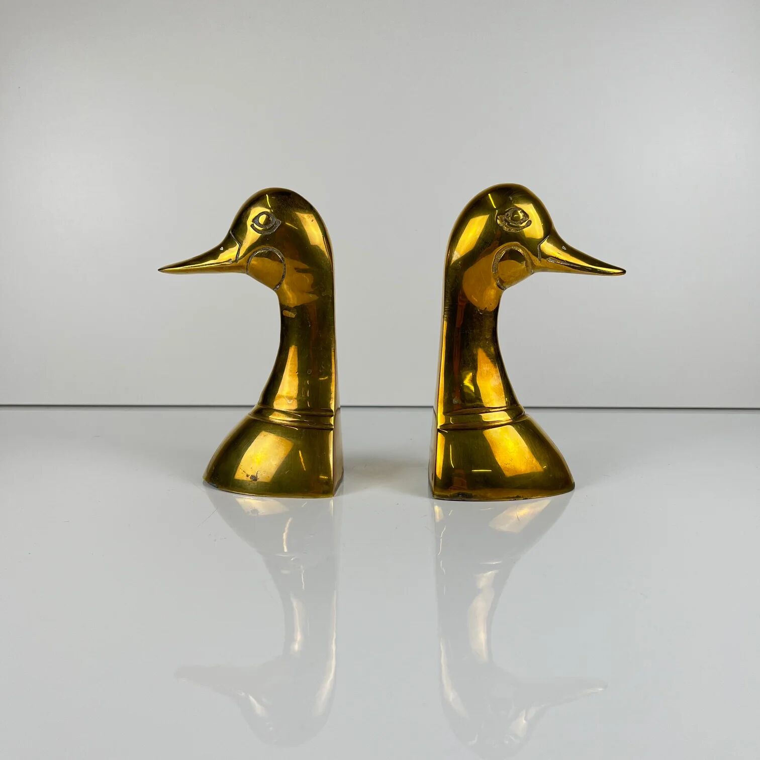 Pair of brass bookends in the shape of a duck's head, 1970.
