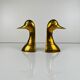 Pair of brass bookends in the shape of a duck's head, 1970.